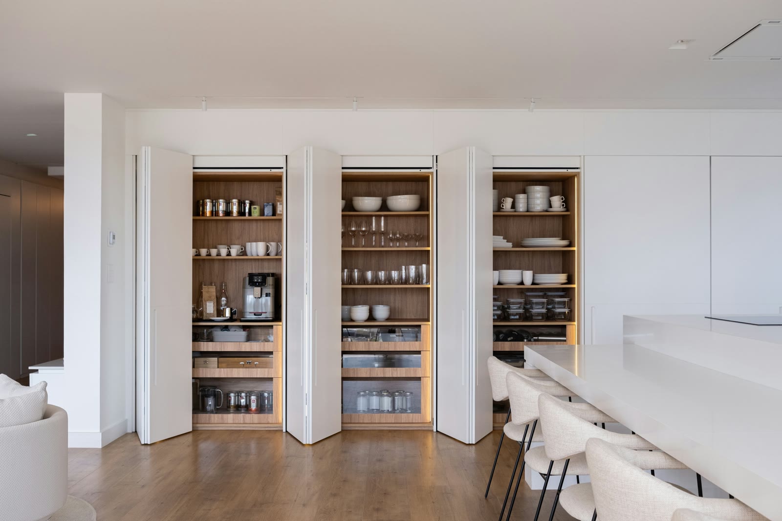 Existing built-in storage wall with open cubbies and drawers