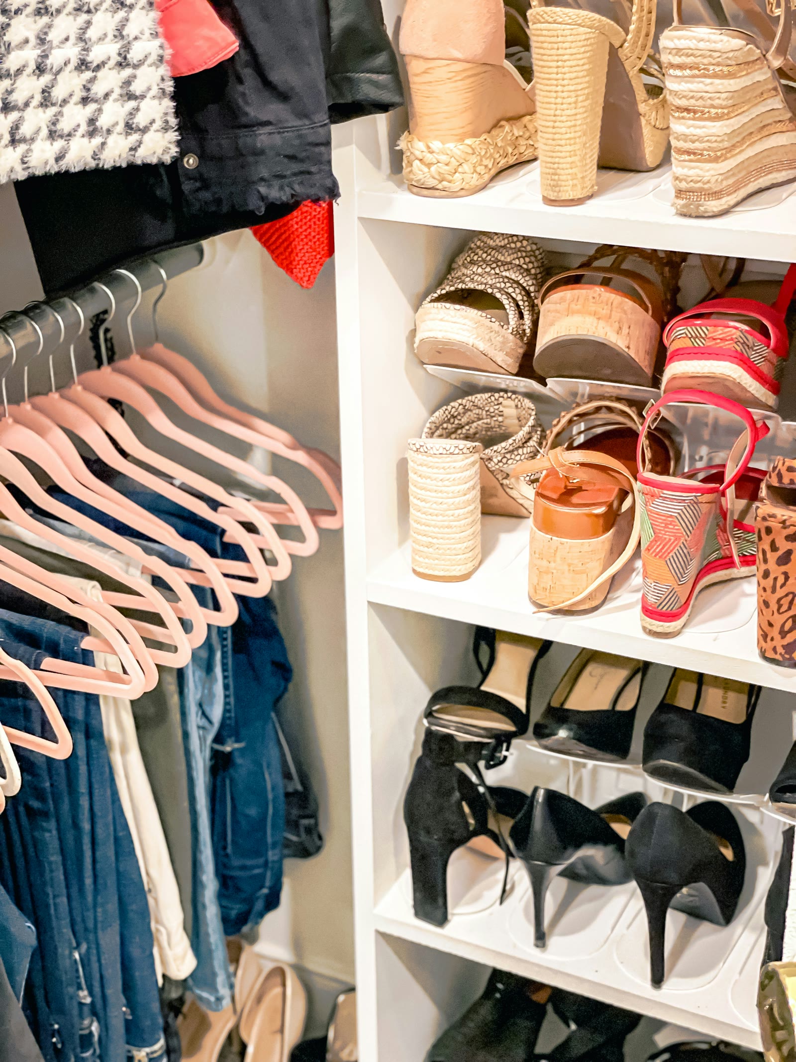 Existing closet with hanging clothes, shoes, and accessories